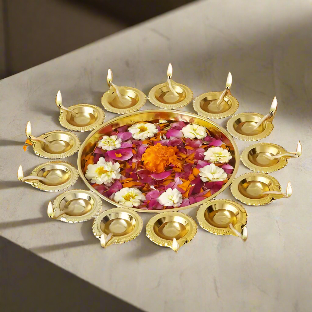 Decorative arrangement with gold lamps and flowers on a wooden surface