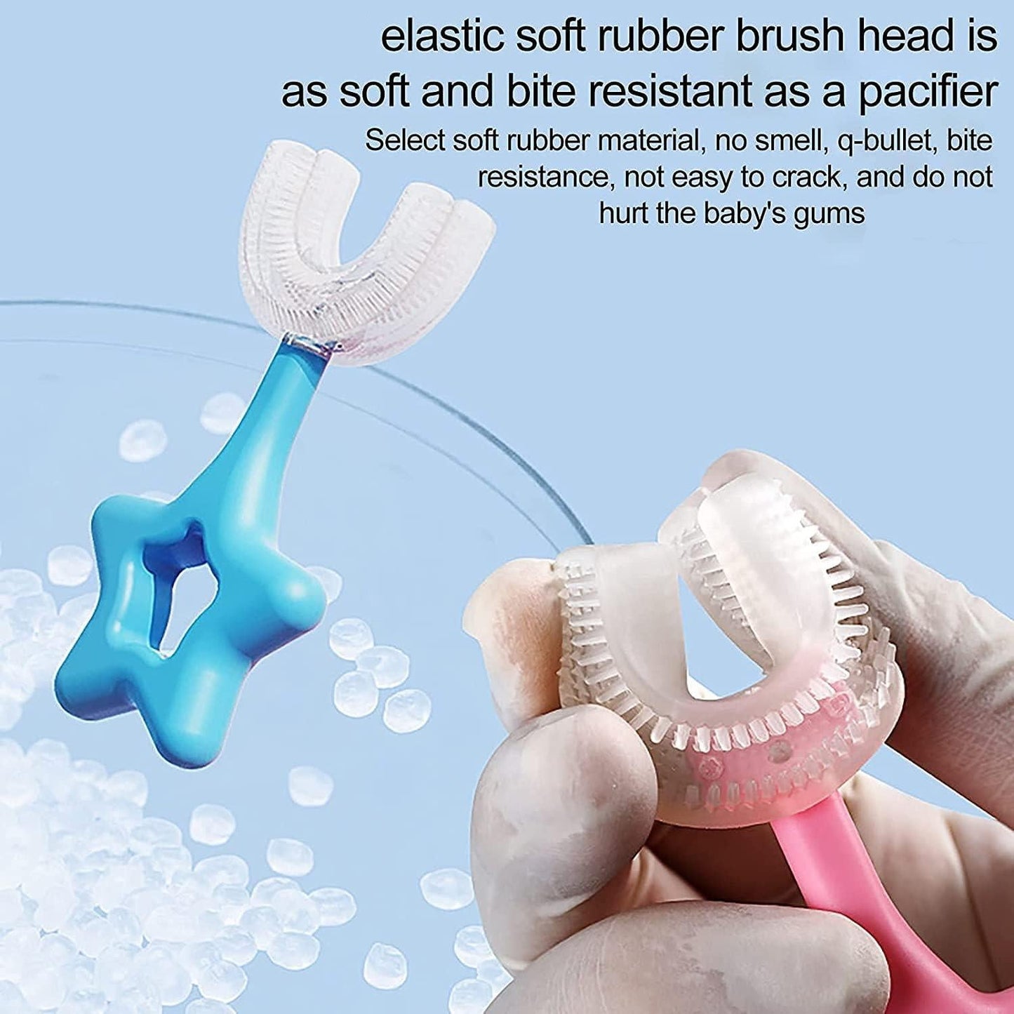 Star-shaped toothbrush with a soft rubber brush head held by a hand against a light blue background.