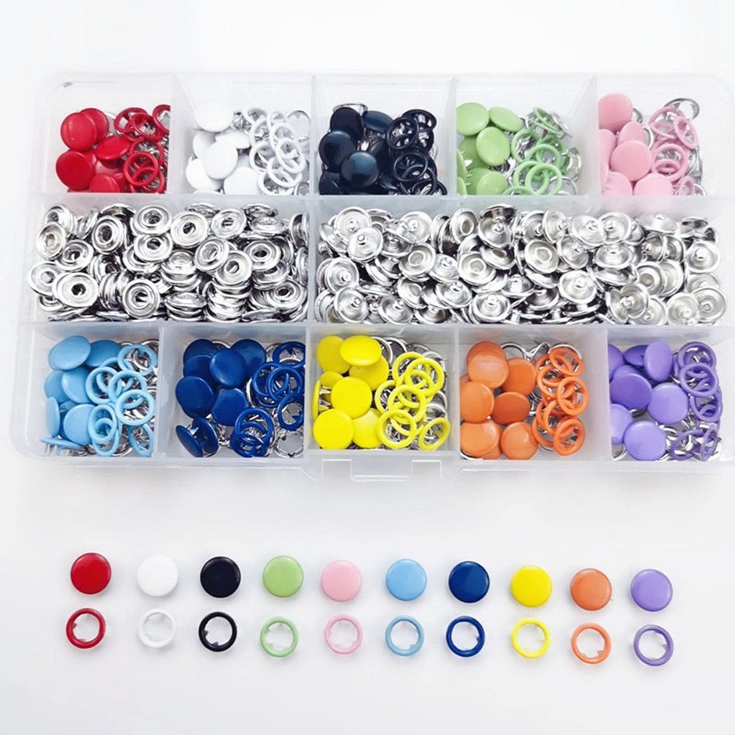 Assorted colorful buttons in a clear organizer on a white background