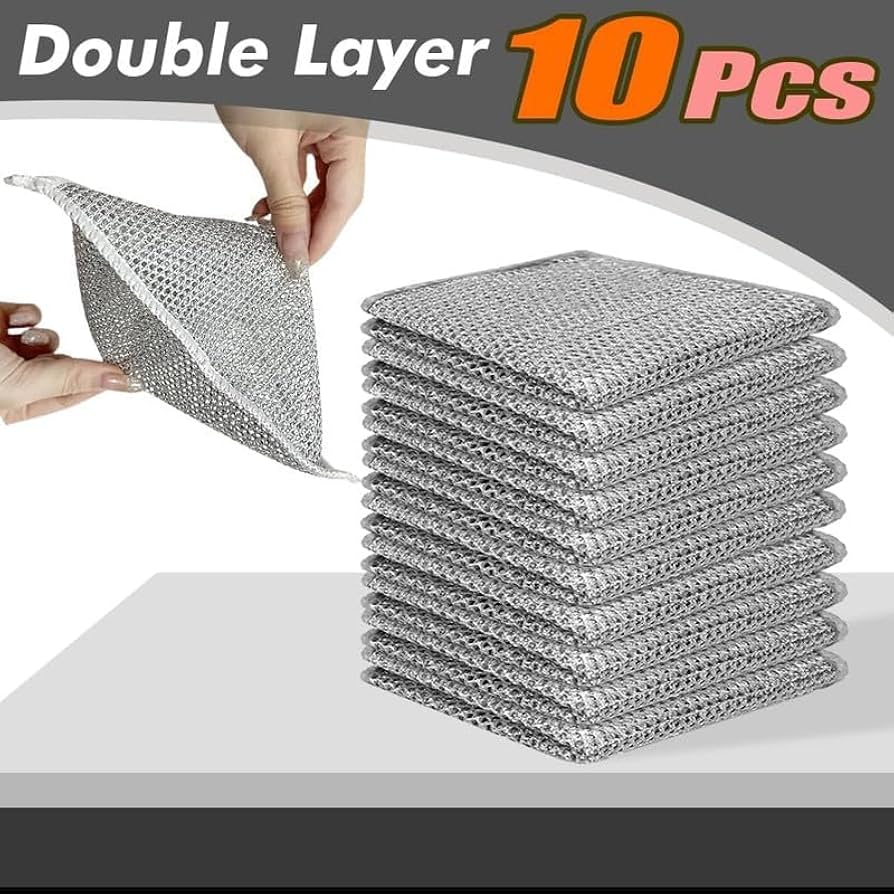 Stack of double-layered metal scrubber cloths with a hand holding one, on a white background.