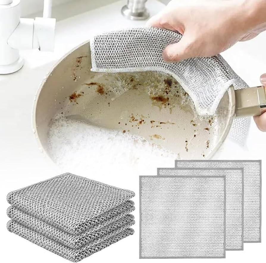 Metal mesh scrubber cleaning a pot with additional scrubbers displayed below.