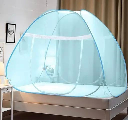 Portable bed tent with mosquito net on a bed in a room.