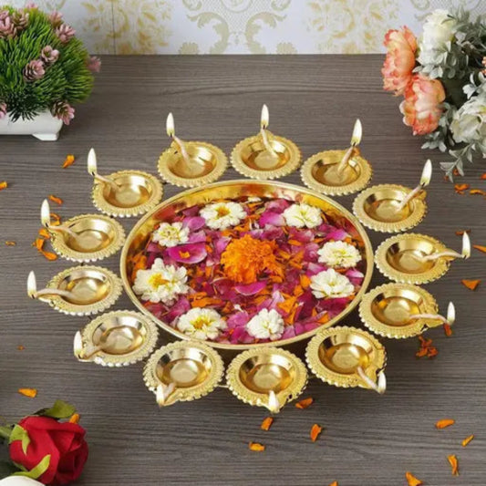 Decorative arrangement with gold lamps and flowers on a wooden surface