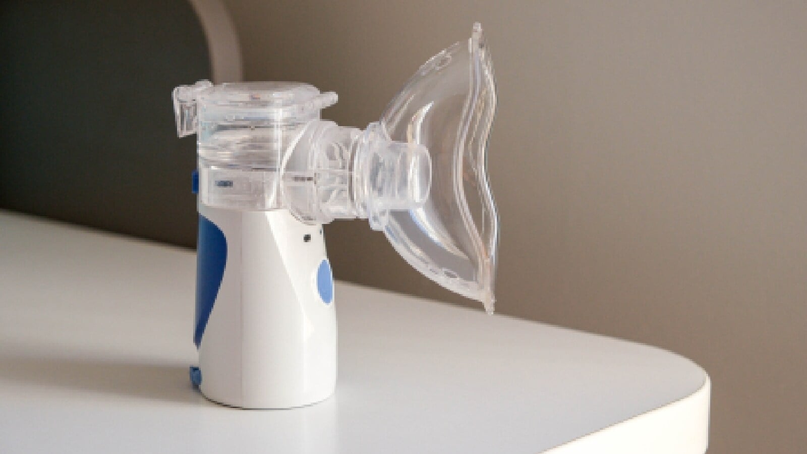 Nebulizer device on a white surface with a neutral background